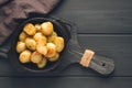 Fresh Cooked, new potatoes,with dill, on a wooden table, selective focus. close-up, toning, no people, Royalty Free Stock Photo