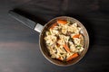 Fresh cooked pasta with mushrooms and vegetables in a pan Royalty Free Stock Photo