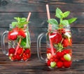 Fresh cool drink of ripe juicy cherry, strawberry, currant and gooseberry berries Royalty Free Stock Photo