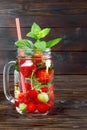 Fresh cool drink of ripe juicy cherry, strawberry, currant and gooseberry berries Royalty Free Stock Photo