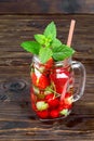 Fresh cool drink of ripe juicy cherry, strawberry, currant and gooseberry berries Royalty Free Stock Photo