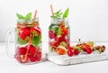 Fresh cool drink of ripe juicy cherry, strawberry, currant and gooseberry berries Royalty Free Stock Photo