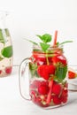 Fresh cool drink of ripe juicy cherry, strawberry, currant and gooseberry berries Royalty Free Stock Photo