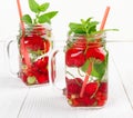 Fresh cool drink of ripe juicy cherry, strawberry, currant and gooseberry berries Royalty Free Stock Photo