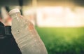 Fresh cool water bottle in soccer field copy space for sport Royalty Free Stock Photo
