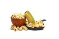 Fresh corn on the cob with bowls of popcorn snack Royalty Free Stock Photo