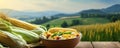 Fresh corn and cobs in bowl on rustic wooden table, Corns field in background