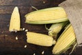 Fresh corn on cobs on rustic wooden table, closeup Royalty Free Stock Photo