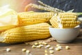 Fresh corn on cobs and sweet corn ears  rustic wooden table background Royalty Free Stock Photo