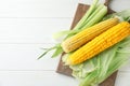 Fresh corn cobs on wooden background Royalty Free Stock Photo