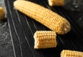 Fresh corn cobs on wooden board Royalty Free Stock Photo