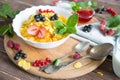 Fresh corn flakes with strawberries and milk close up Healthy tasty breakfast cornflakes with strawberries, raspberries Royalty Free Stock Photo