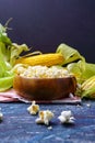 Fresh corn and popcorn on cobs on black background. Vertical photo. Copyspace Royalty Free Stock Photo