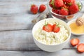 Fresh cottage cheese with fresh strawberries, healthy breakfast concept Royalty Free Stock Photo