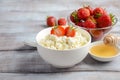 Fresh cottage cheese with fresh strawberries, healthy breakfast concept Royalty Free Stock Photo