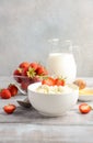 Fresh cottage cheese with fresh strawberries, healthy breakfast concept Royalty Free Stock Photo