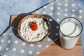 Fresh cottage cheese with strawberries and a glass of milk on a wooden plate. Healthy eating concept. Breakfast. Royalty Free Stock Photo