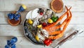 Fresh crab claws with ice and vegetables in a metal bowl