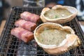 Fresh crab and pork are grilled on mini strove, in local Japanese restaurant Royalty Free Stock Photo