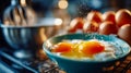Fresh cracked eggs in a blue mixing bowl ready for baking, surrounded by warm kitchen lights Royalty Free Stock Photo