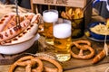 Fresh craft beer. German sausages on the grill. Traditional German sausages and pastry brezel for a beer festival. Wood