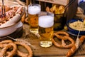 Fresh craft beer. German sausages on the grill. Traditional German sausages and pastry brezel for a beer festival. Wood