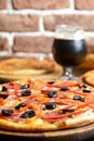 Fresh craft beer and pizza with vegetables and meat. Party concept, different kinds of pizza with delicious craft beer Royalty Free Stock Photo