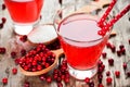 Fresh cranberry drink on wooden background. Red Royalty Free Stock Photo