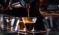 Fresh creamy cappuccino is poured into the little transparent cup. Coffee machine working in a cafÃÂ©. Close up. Generative AI Royalty Free Stock Photo