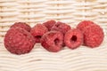 Fresh crimson raspberry with braided rattan