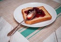 Morning toast with strawbery jam