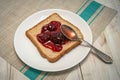 Morning toast with strawbery jam