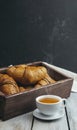 Fresh crispy croissants and a cup of fragrant tea. Breakfast. Morning. customs and culture. Start of the day