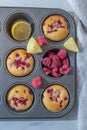 Sweet vanilla raspberry muffins on a table Royalty Free Stock Photo