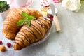 Fresh Croissant with berries and jam for breakfast isolated on white wooden background , copy space Royalty Free Stock Photo