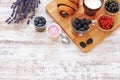 Fresh croissant, berries, yogurt and cup of milk on a wooden table. Royalty Free Stock Photo