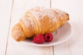 Fresh croissant and raspberry