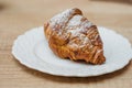 Fresh croissant. Refreshing coffee drink on a table gray background Royalty Free Stock Photo