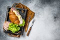 Fresh croissant sandwich with ham, cheese and salad leaf. Gray background. Top view. Copy space Royalty Free Stock Photo