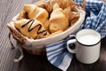 Fresh croissants basket and milk Royalty Free Stock Photo