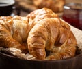 Fresh croissants in a wooden bowl