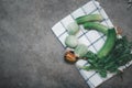 Fresh cucumber, eggplant and cilantro sorted with cutlery. Ready vegetable side dish served