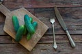 Fresh cucumber on the wood plate