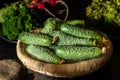 Fresh cucumbers in a basket. Blurred background