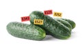 Fresh cucumbers with E numbers on background. Harmful food additives Royalty Free Stock Photo