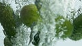 Fresh cucumbers falling water closeup. Seasonal garden vegetables drop flowing