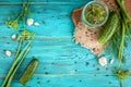 Fresh cucumbers ready for canning with dill, garlic and spices on blue wooden background. Cucumbers for pickling Royalty Free Stock Photo