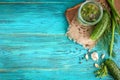 Fresh cucumbers ready for canning with dill, garlic and spices on blue wooden background. Cucumbers for pickling Royalty Free Stock Photo