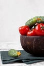 Fresh cucumbers and tomatoes in a wooden bowl Royalty Free Stock Photo