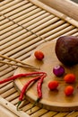 Fresh culinary ingredients for sauce guacamole on bamboo. Royalty Free Stock Photo